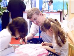 Pascal Lecocq with young drawing contestants at the Paris Dive show 2007, with publishing parents authorization