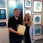 The President of the Paris Dive Show, Helene de Tayrac-Senik presents the 20 years of the Paris Dive Show in Pictures to Pascal.